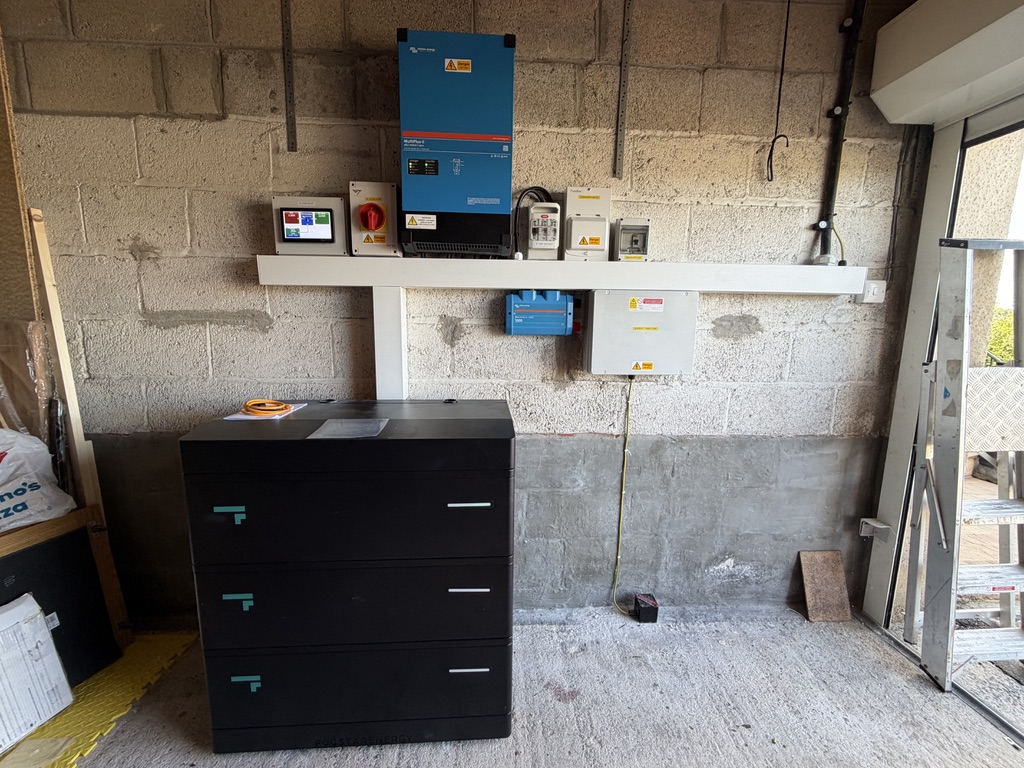 Victron inverter and controls beside a three-module Fogstar battery stack